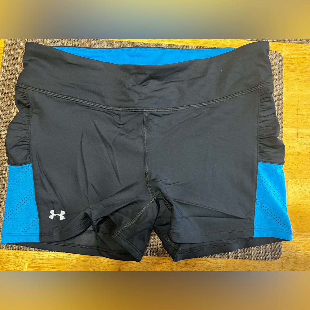 Under Armor heat gear shorts Size: Large color black and blue. Like new.